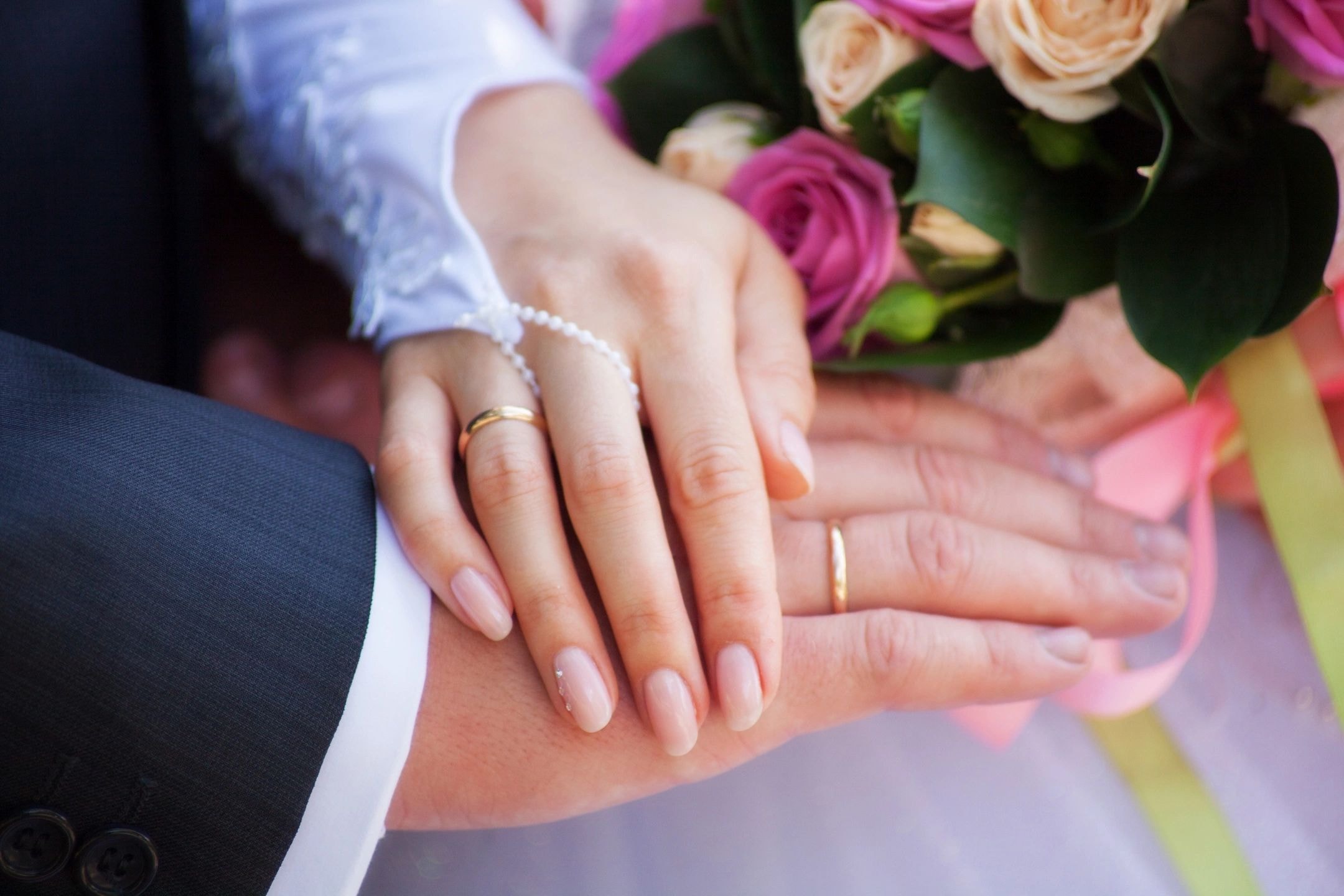 Testimonials — wedding rings and bouquet